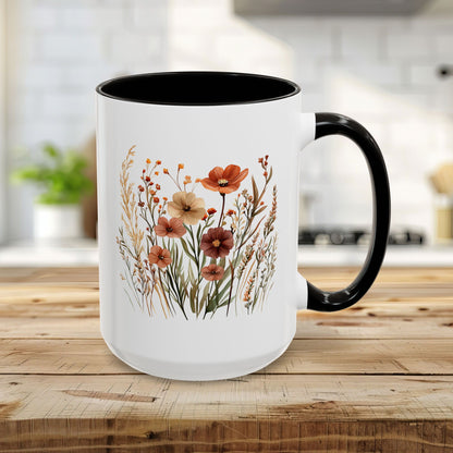 15oz white ceramic mug with black handle and interior, featuring warm autumn wildflower watercolor art.