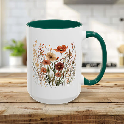 15oz white ceramic mug with green handle and interior, featuring warm autumn wildflower watercolor art.
