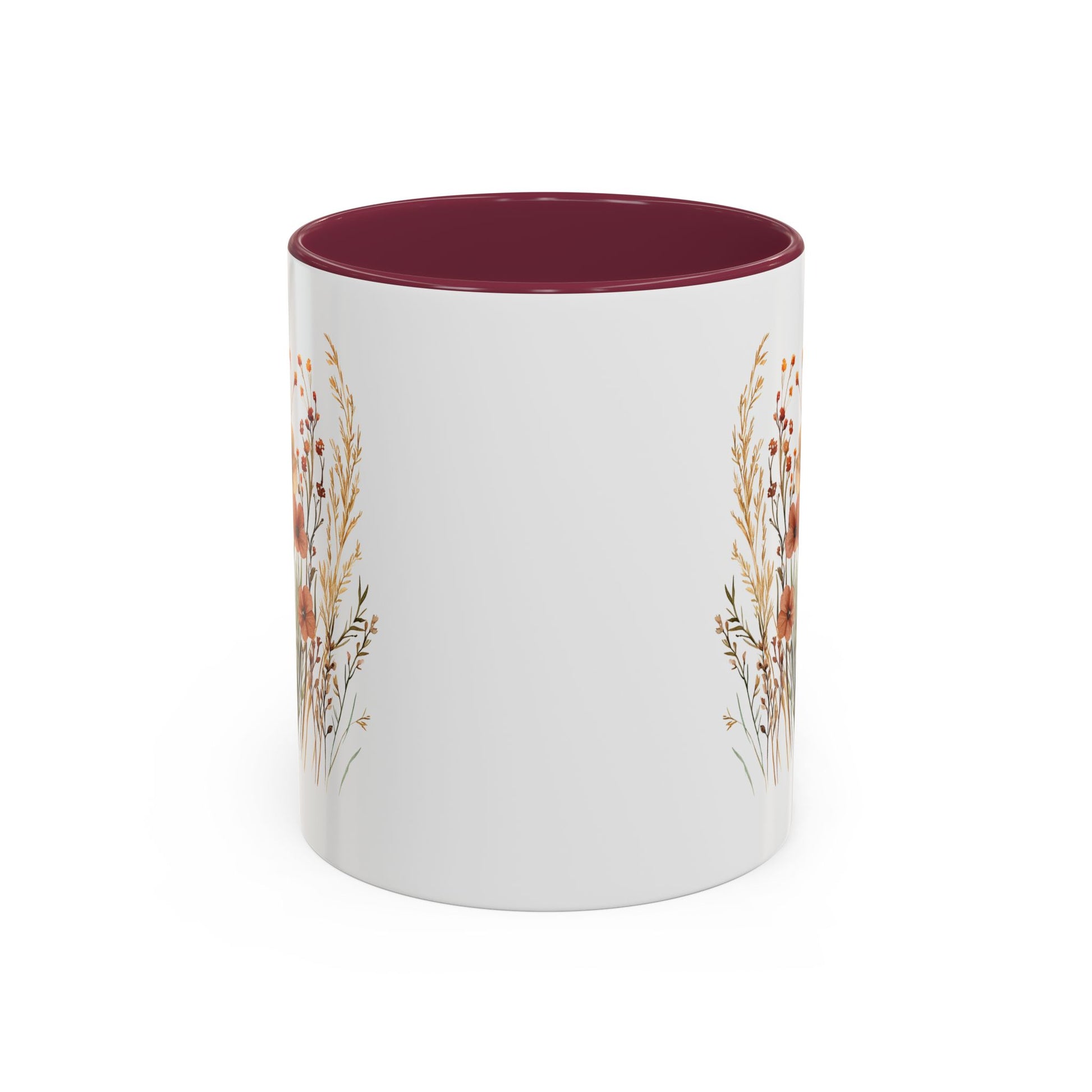 White ceramic mug with a deep red interior and handle, featuring watercolor autumn wildflowers.