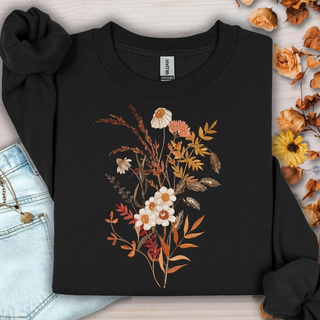 Black cotton-blend sweatshirt with a vintage autumn wildflower bouquet in warm beige and rust tones.