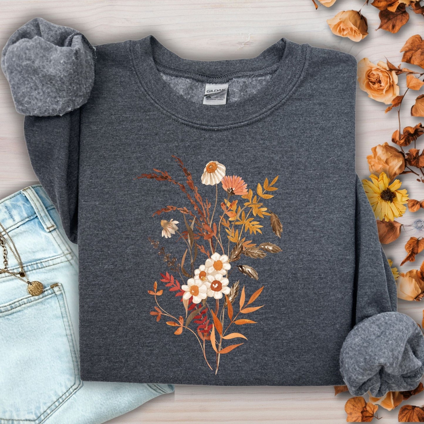 Dark heather gray cotton-blend sweatshirt with a vintage autumn wildflower bouquet in beige, rust, and warm tones.