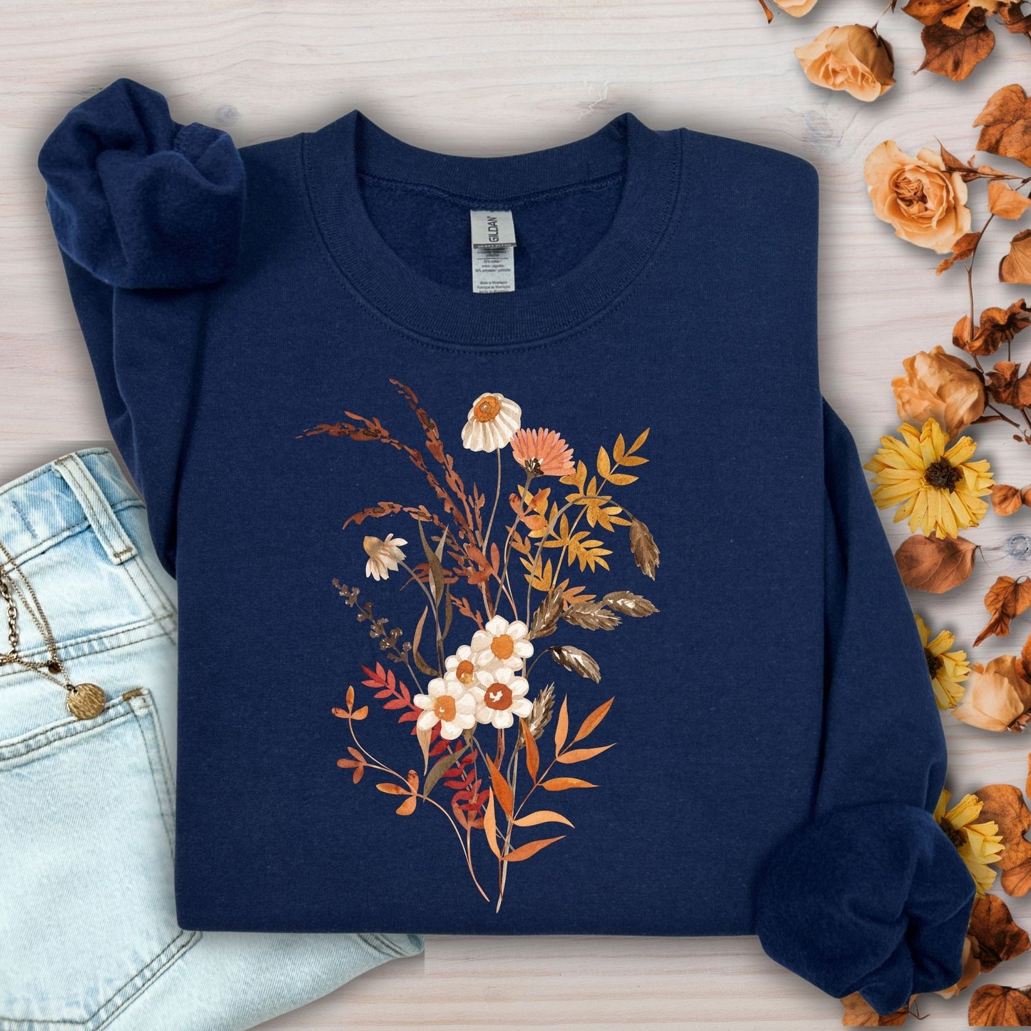 Navy cotton-blend sweatshirt with a vintage autumn wildflower bouquet in warm beige and rust tones.