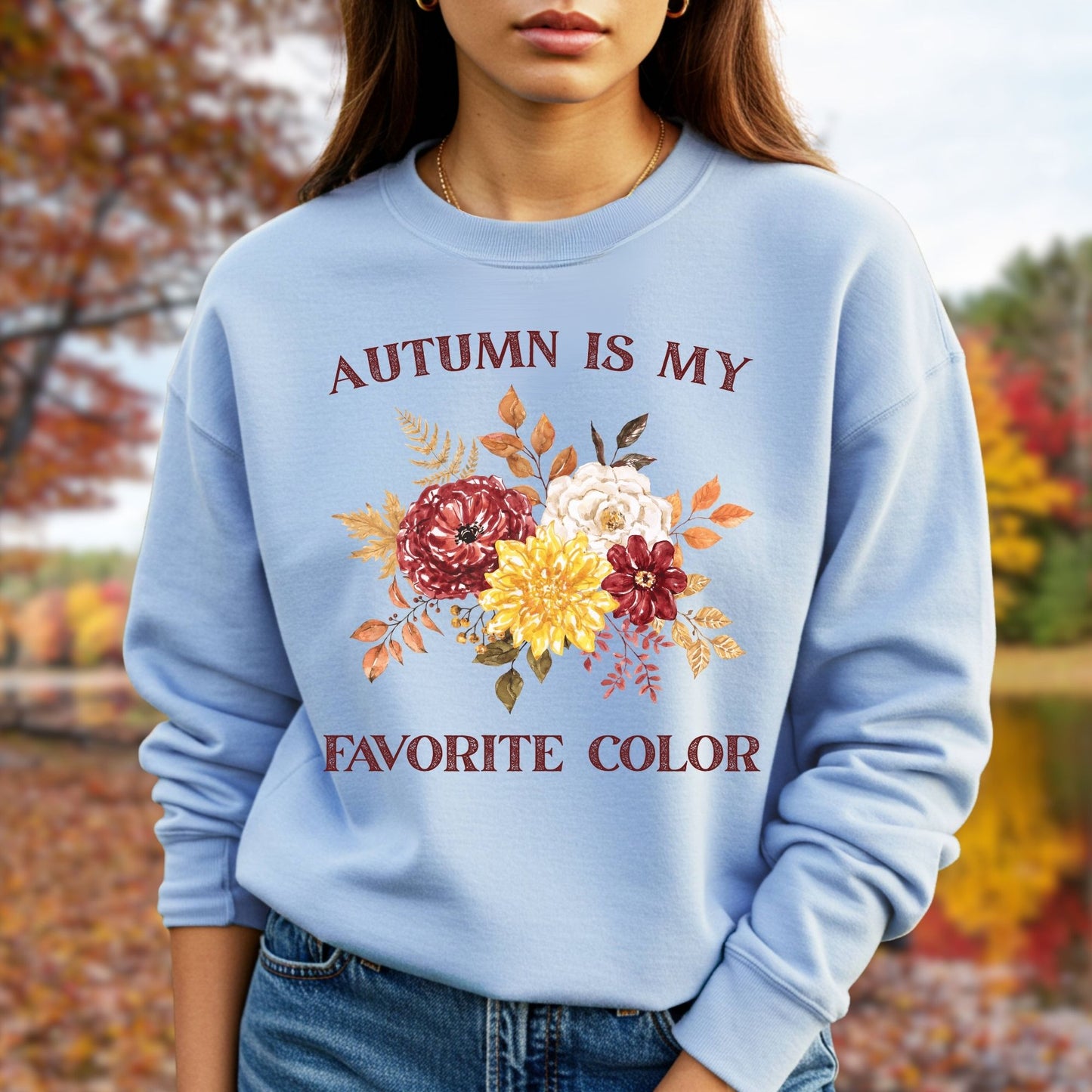 Light blue sweatshirt with "Autumn is My Favorite Color" text and watercolor autumn flowers.