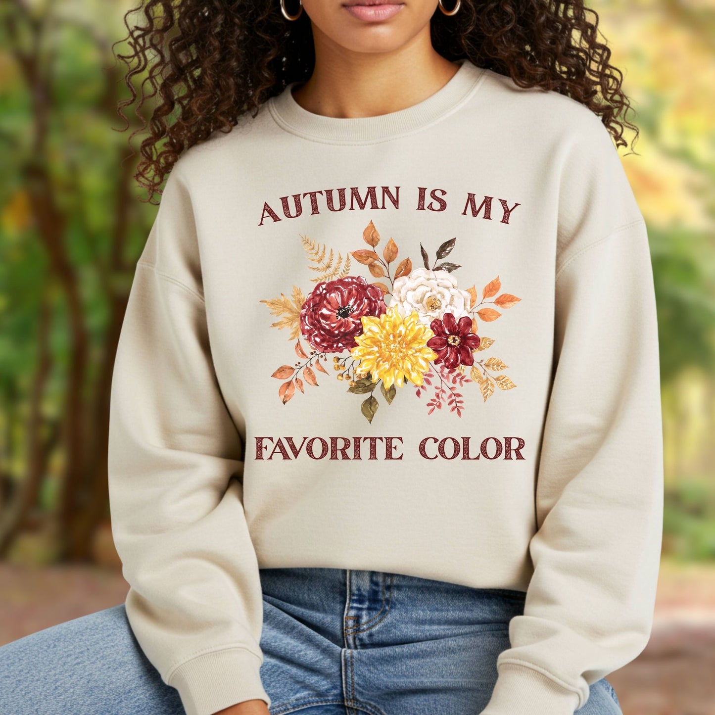 Cream sweatshirt with "Autumn is My Favorite Color" text and watercolor autumn flowers.