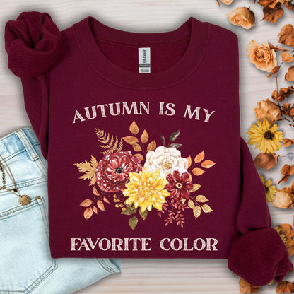 Maroon Gildan sweatshirt with "Autumn is My Favorite Color" text and watercolor autumn flowers.