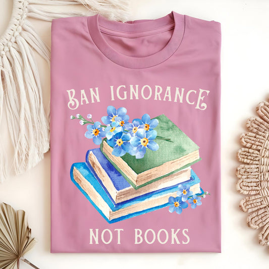Azalea S t-shirt with "Ban Ignorance, Not Books" text, vintage books, and blue forget-me-not flowers.