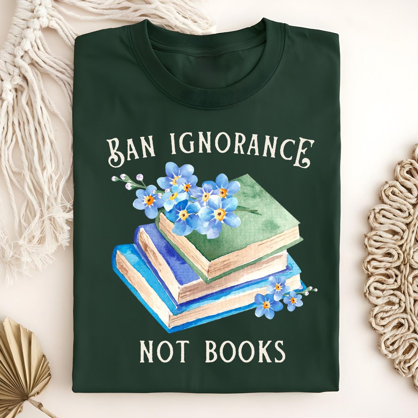 Forest Green "Ban Ignorance, Not Books" t-shirt with watercolor vintage books and blue forget-me-nots.