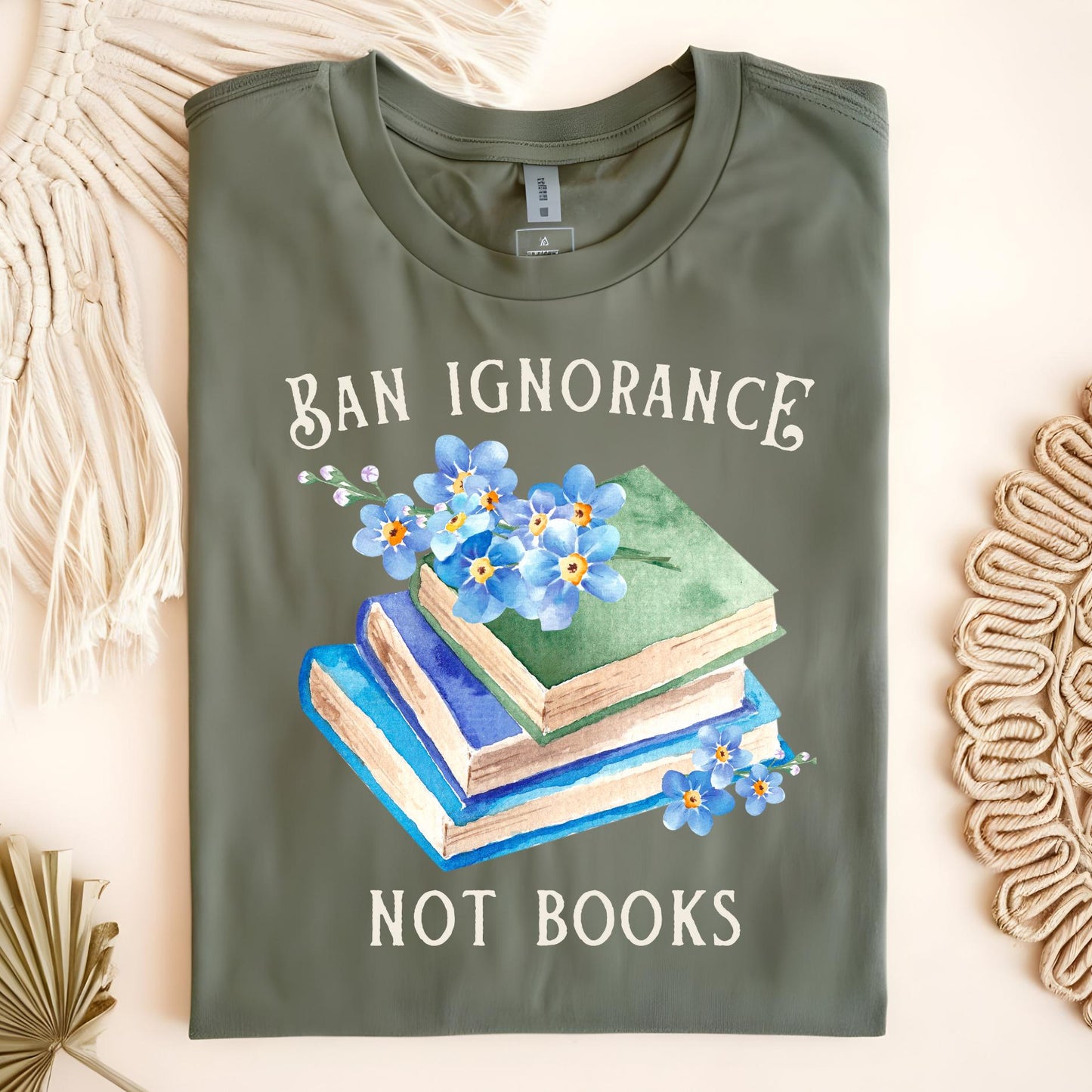 Military Green "Ban Ignorance, Not Books" tee with vintage books and blue forget-me-nots.
