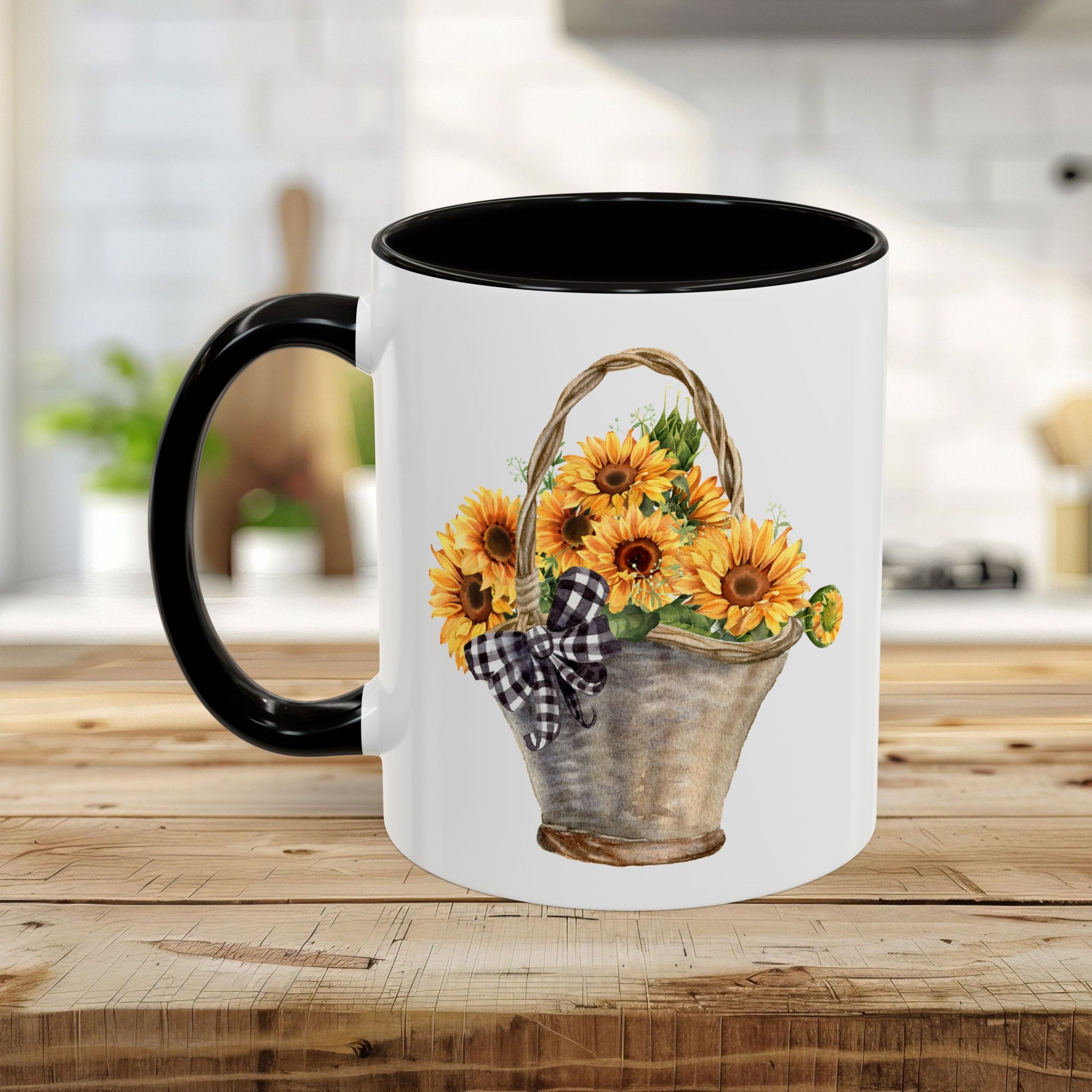 White ceramic mug with black handle and interior, featuring a watercolor basket of sunflowers and a gingham bow.