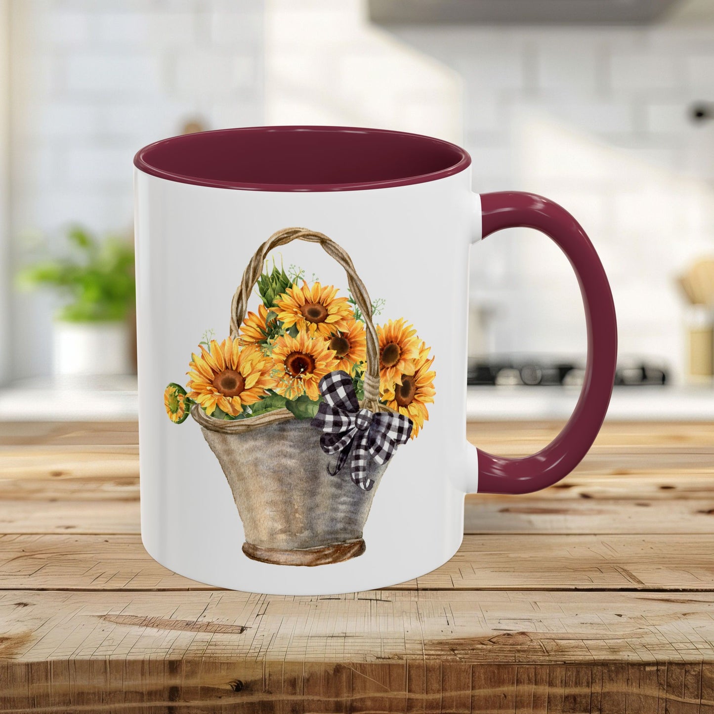 11oz ceramic mug with maroon trim, C-handle, and a watercolor basket of sunflowers with a gingham bow.