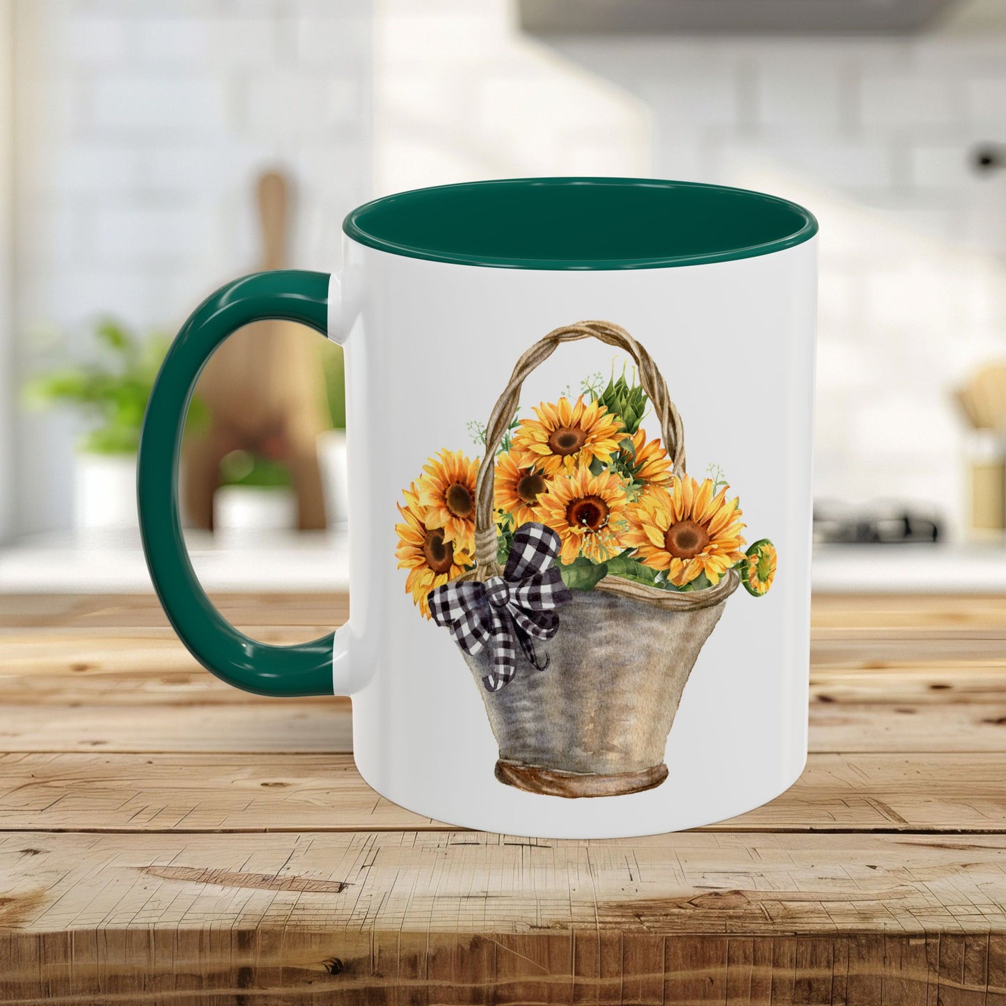 White ceramic mug with a green handle and interior, featuring a hand-painted basket of sunflowers.