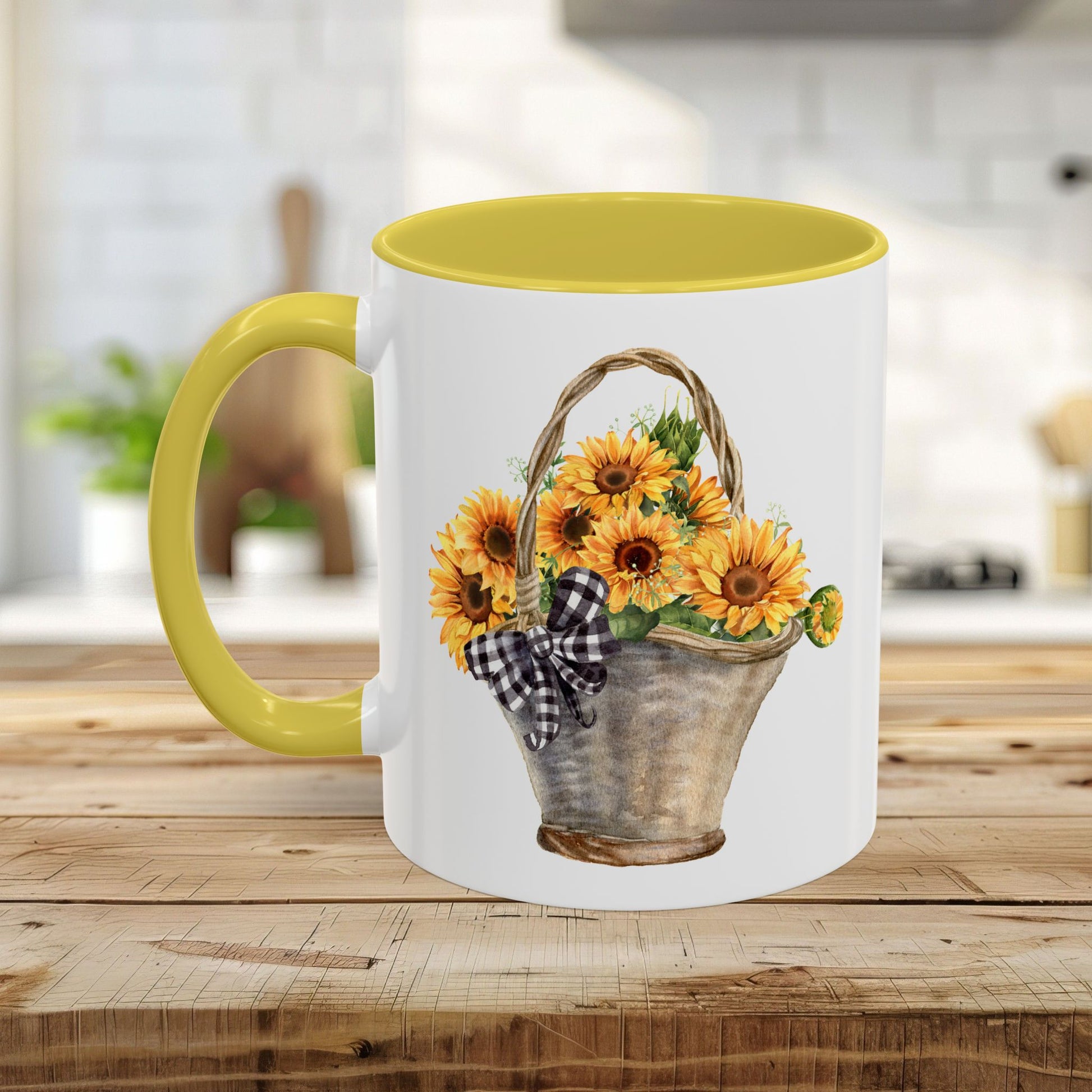 White ceramic mug with yellow interior and handle, featuring a watercolor basket of sunflowers and a gingham bow.