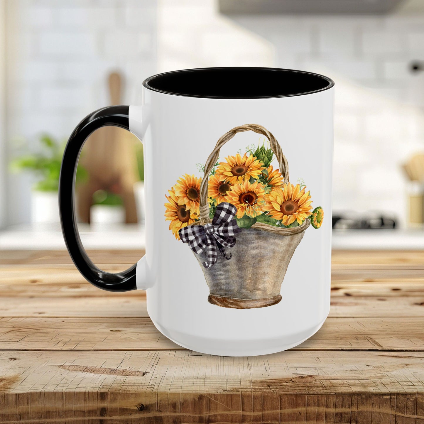 White ceramic mug with black handle and interior, featuring a watercolor basket of sunflowers and a gingham bow.