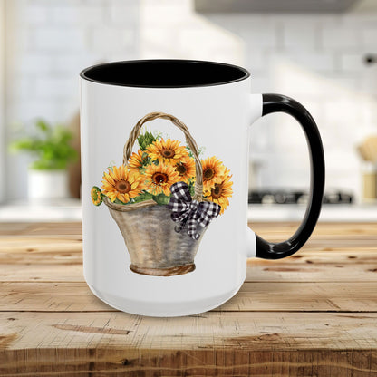 15oz white ceramic mug with black trim and handle, featuring a hand-painted basket of sunflowers.