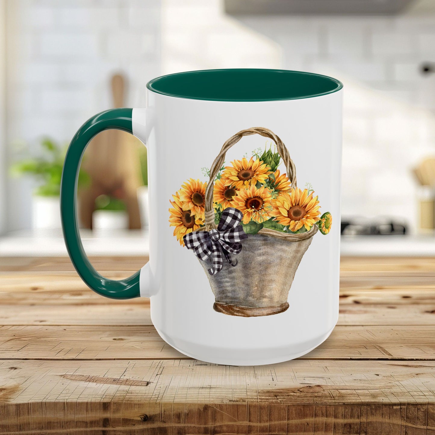 White ceramic mug with a green handle and interior, featuring a hand-painted basket of sunflowers.