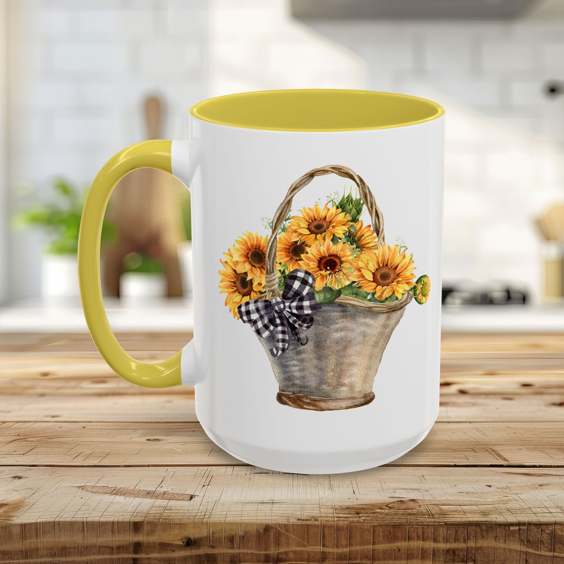 White ceramic mug with yellow interior and handle, featuring a watercolor basket of sunflowers and a gingham bow.
