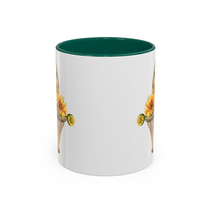 White ceramic mug with a dark green interior and a watercolor basket of sunflowers design.