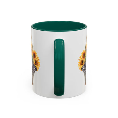 White ceramic mug with a dark green handle and interior, featuring a watercolor basket of sunflowers.