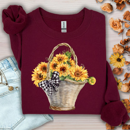 Maroon Gildan sweatshirt with a watercolor basket of golden sunflowers and a black-and-white checkered bow.
