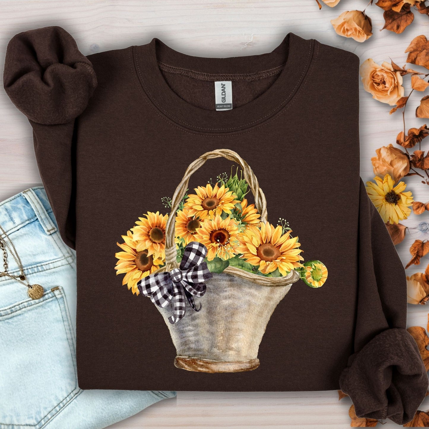 Dark chocolate Gildan sweatshirt with a watercolor basket of sunflowers and a black-and-white checkered bow.