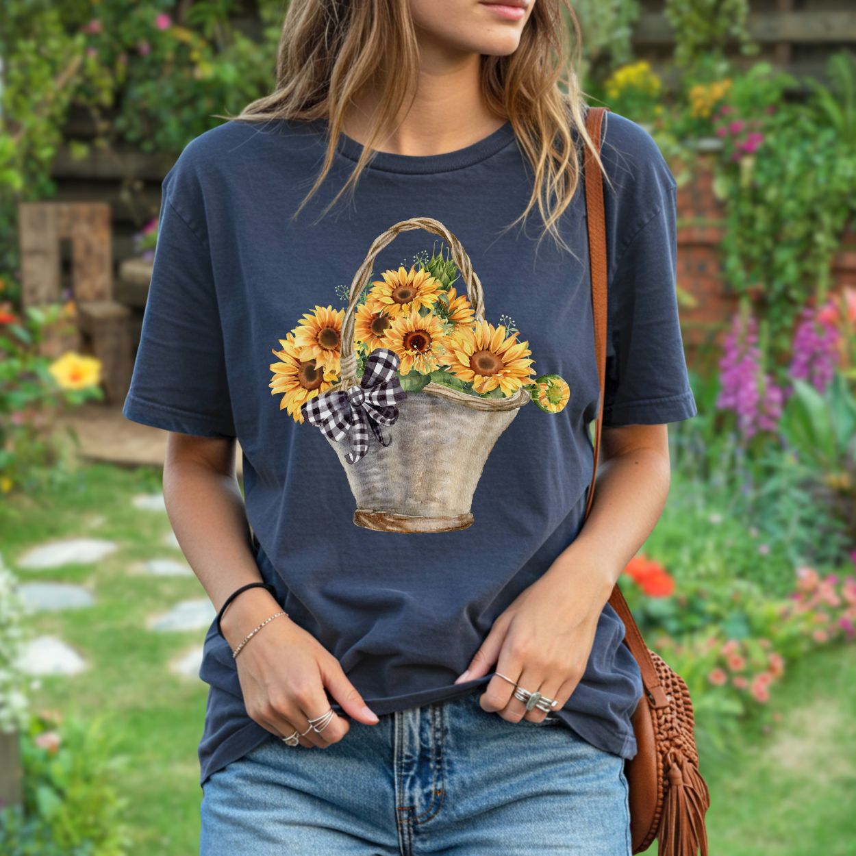 Garment-dyed navy t-shirt with a watercolor basket of sunflowers and a gingham bow.