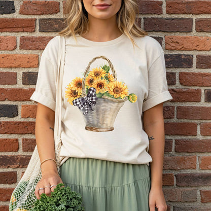 Relaxed-fit, garment-dyed cream t-shirt with a watercolor basket of sunflowers and a gingham bow.