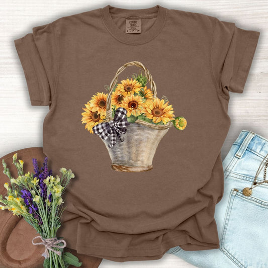 Espresso garment-dyed t-shirt with a watercolor basket of sunflowers and a gingham bow.