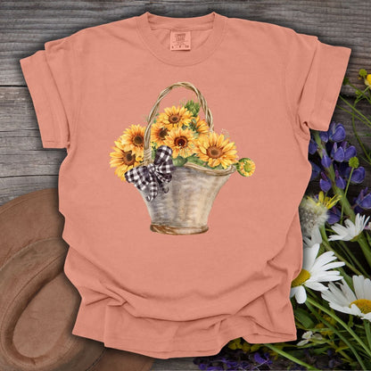 Terracotta S t-shirt with a watercolor basket of sunflowers and a gingham bow.