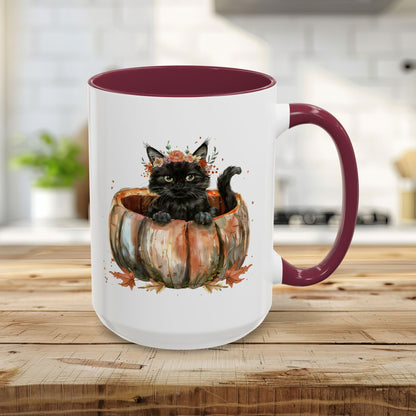 15oz white ceramic mug with maroon interior/handle, featuring a watercolor black kitten in a pumpkin.