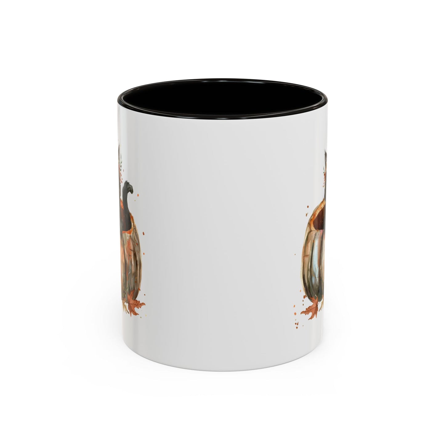 White ceramic mug with black interior and handle, featuring a watercolor black kitten in a pumpkin design.