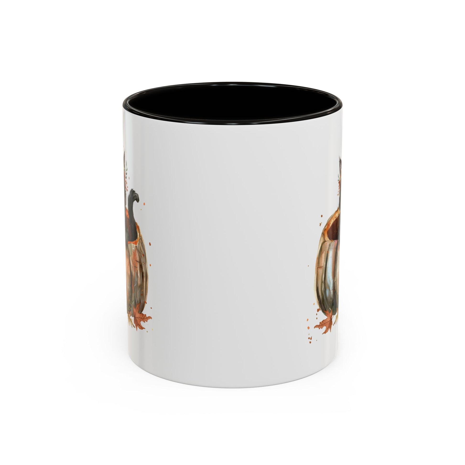 White ceramic mug with black interior and handle, featuring a watercolor black kitten in a pumpkin design.
