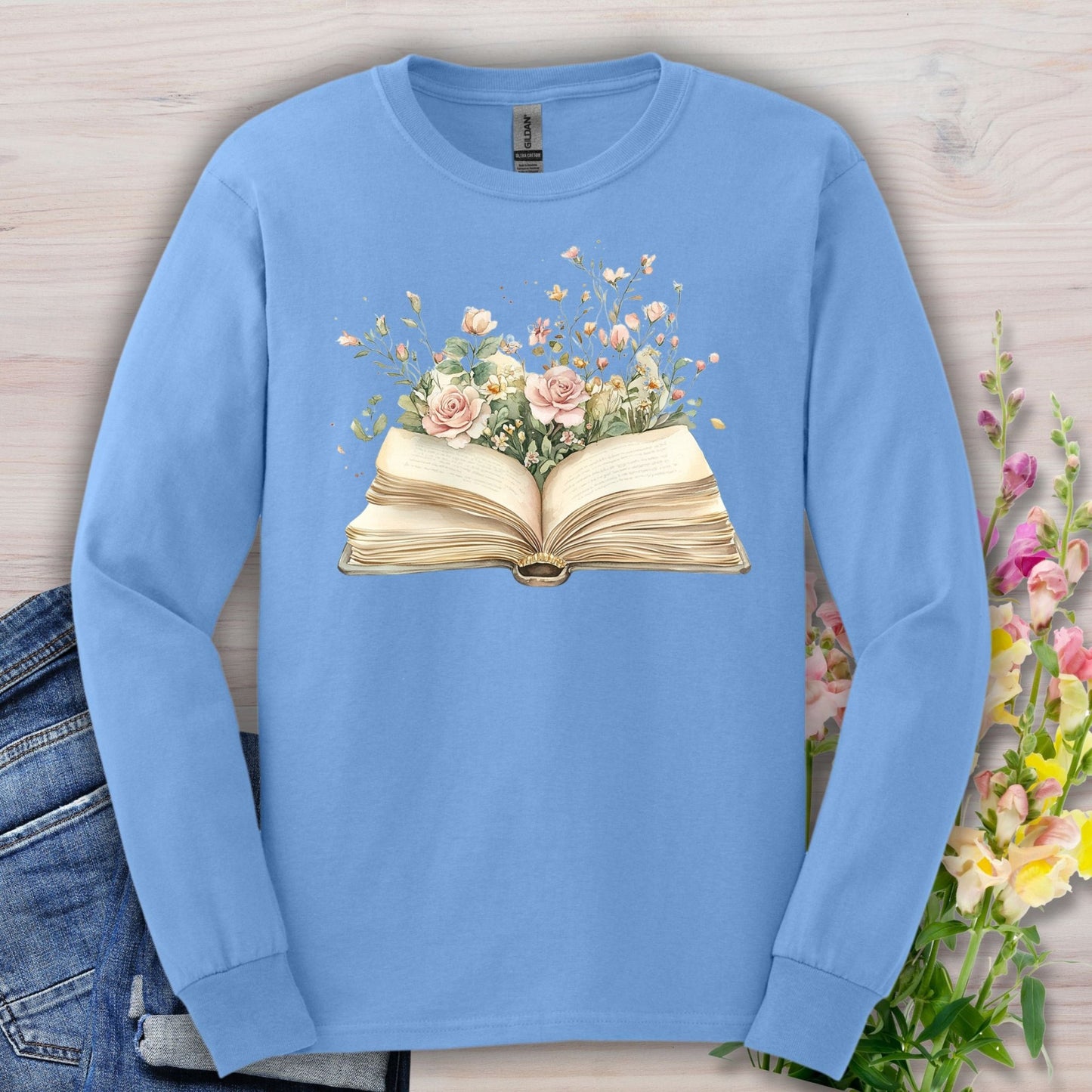 Carolina Blue long sleeve tee with an open vintage book design blooming with roses and wildflowers.