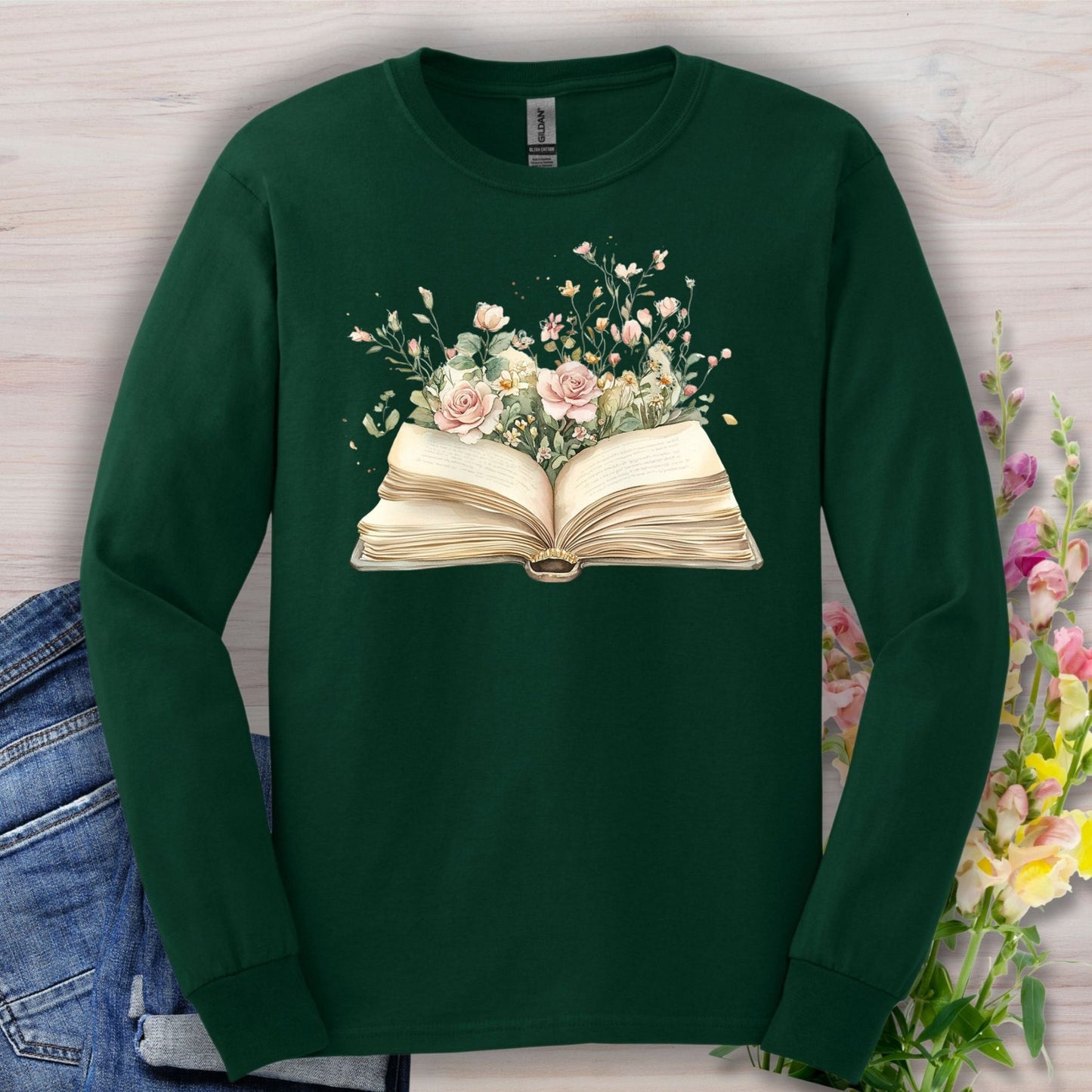 Forest Green long sleeve tee with an open vintage book design blooming with pink roses and wildflowers.