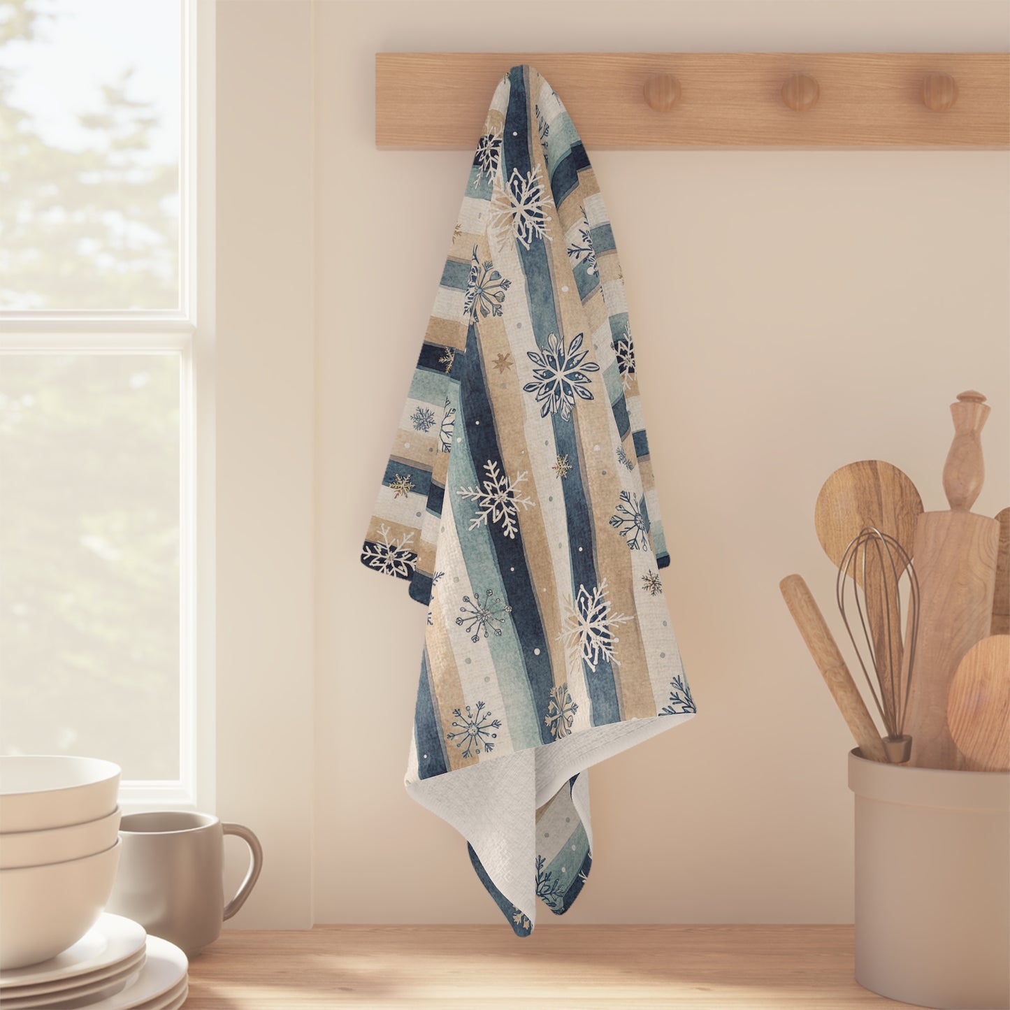 Blue Boho Snowflake Stripe Microfiber Tea Towel, 16x25 inch, hanging on a wooden peg rack in a kitchen.