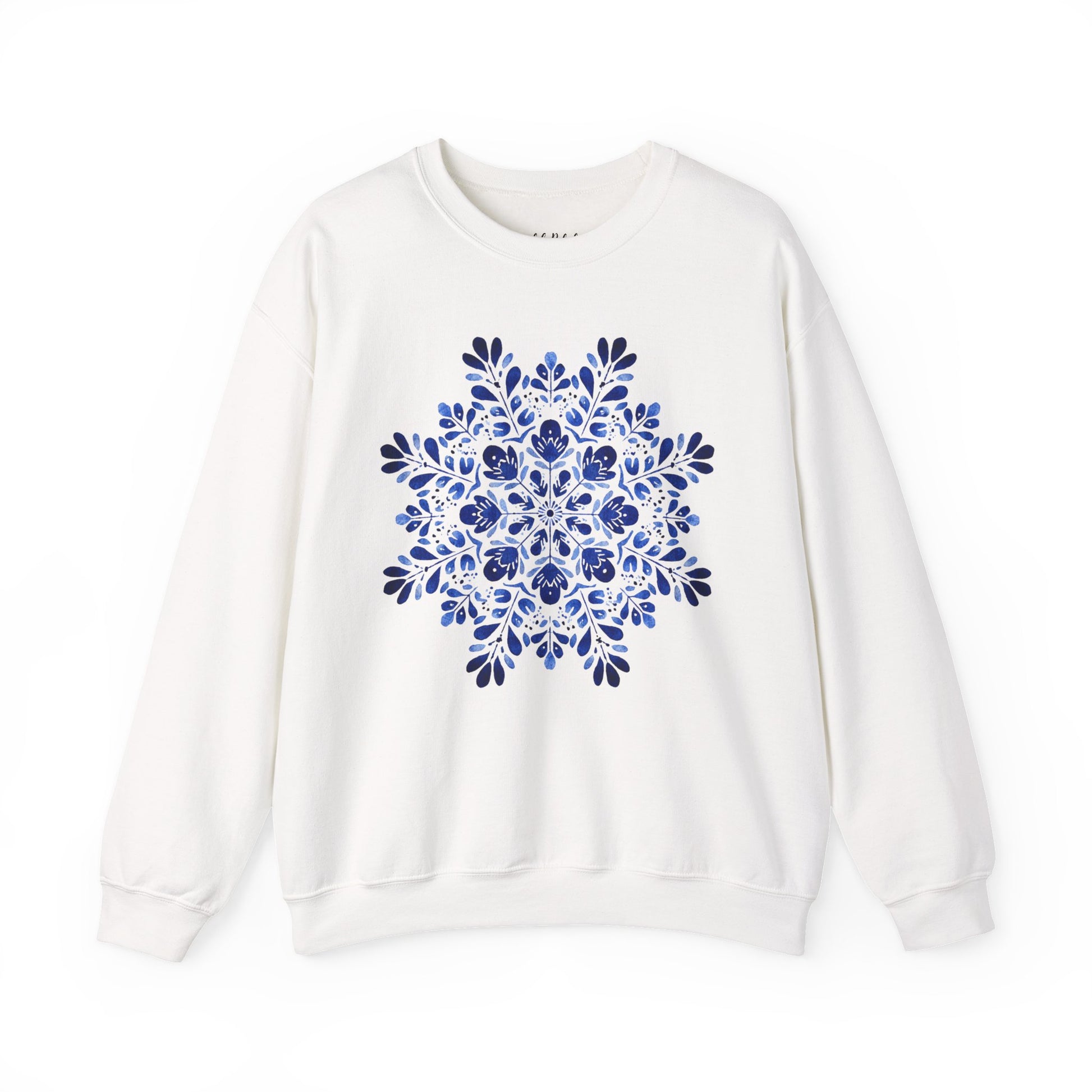 White crewneck sweatshirt with a symmetrical blue folk art floral snowflake design.