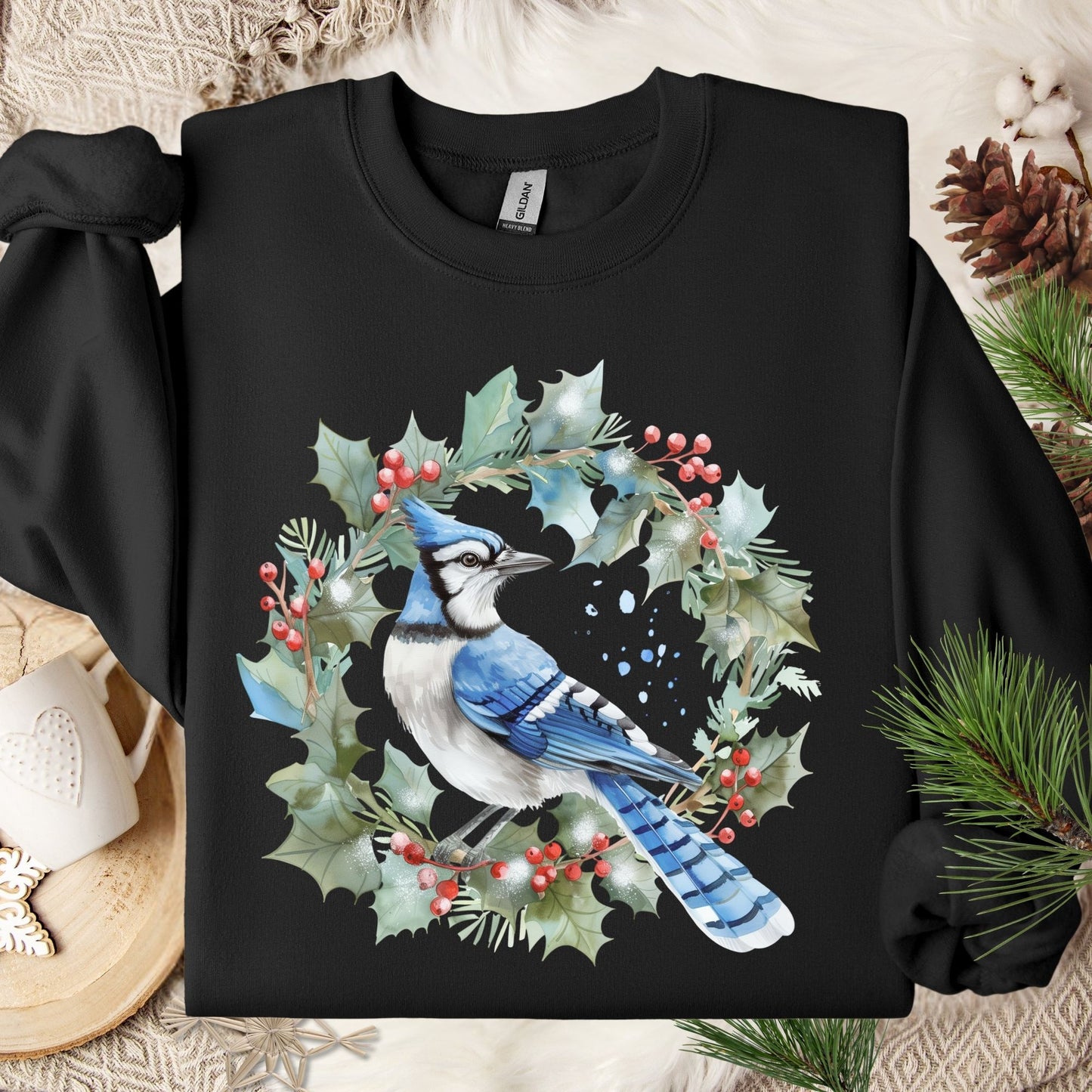 Black Gildan 18000 sweatshirt with a blue jay in a holly wreath watercolor design.