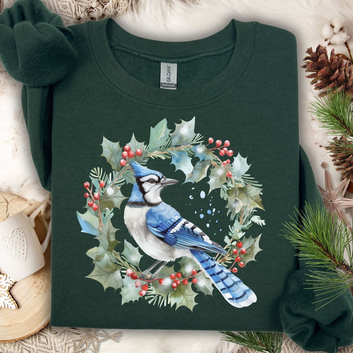 Forest Green Gildan 18000 sweatshirt with a watercolor blue jay in a holly wreath design.