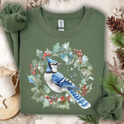 Military green Gildan 18000 sweatshirt with a watercolor blue jay in a holly wreath design.