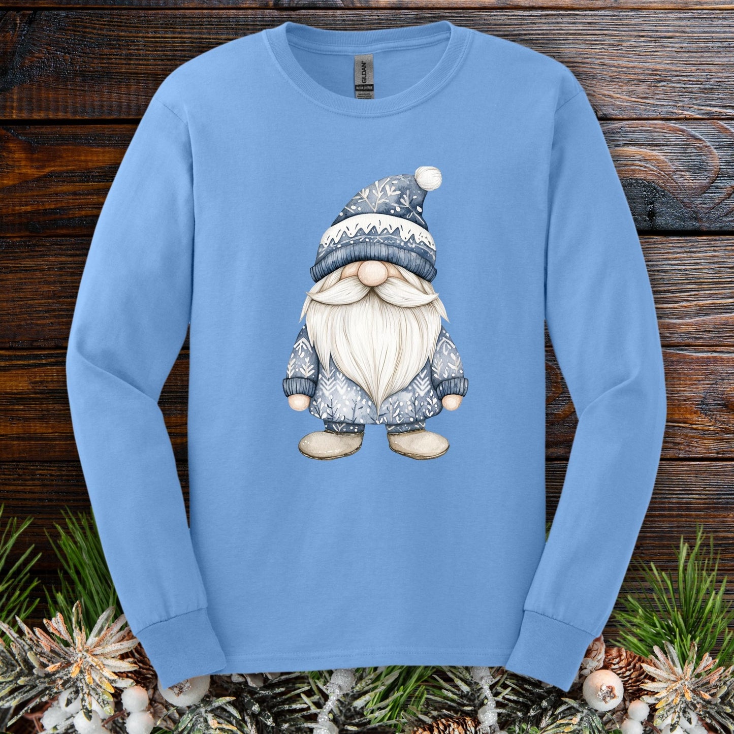 Light blue long sleeve tee with a hand-illustrated Nordic gnome in muted blues and white.