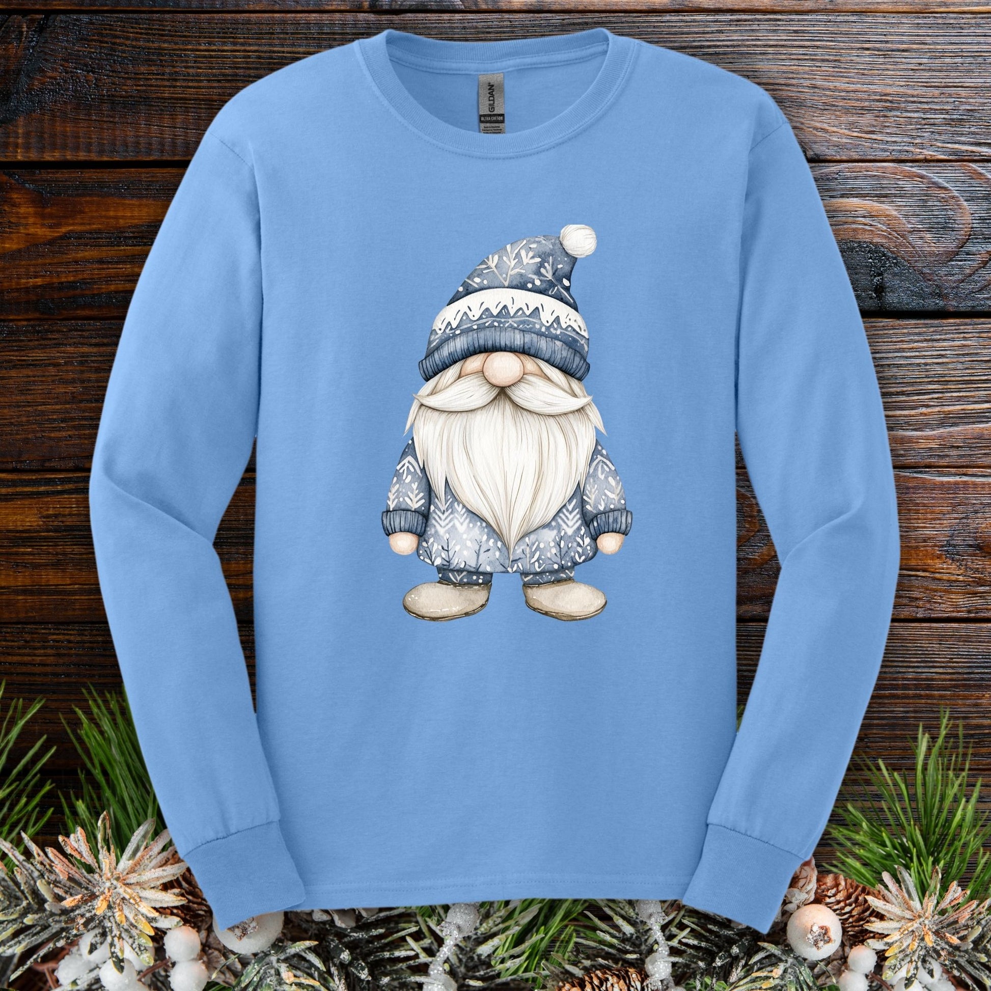 Light blue long sleeve tee with a hand-illustrated Nordic gnome in muted blues and white.