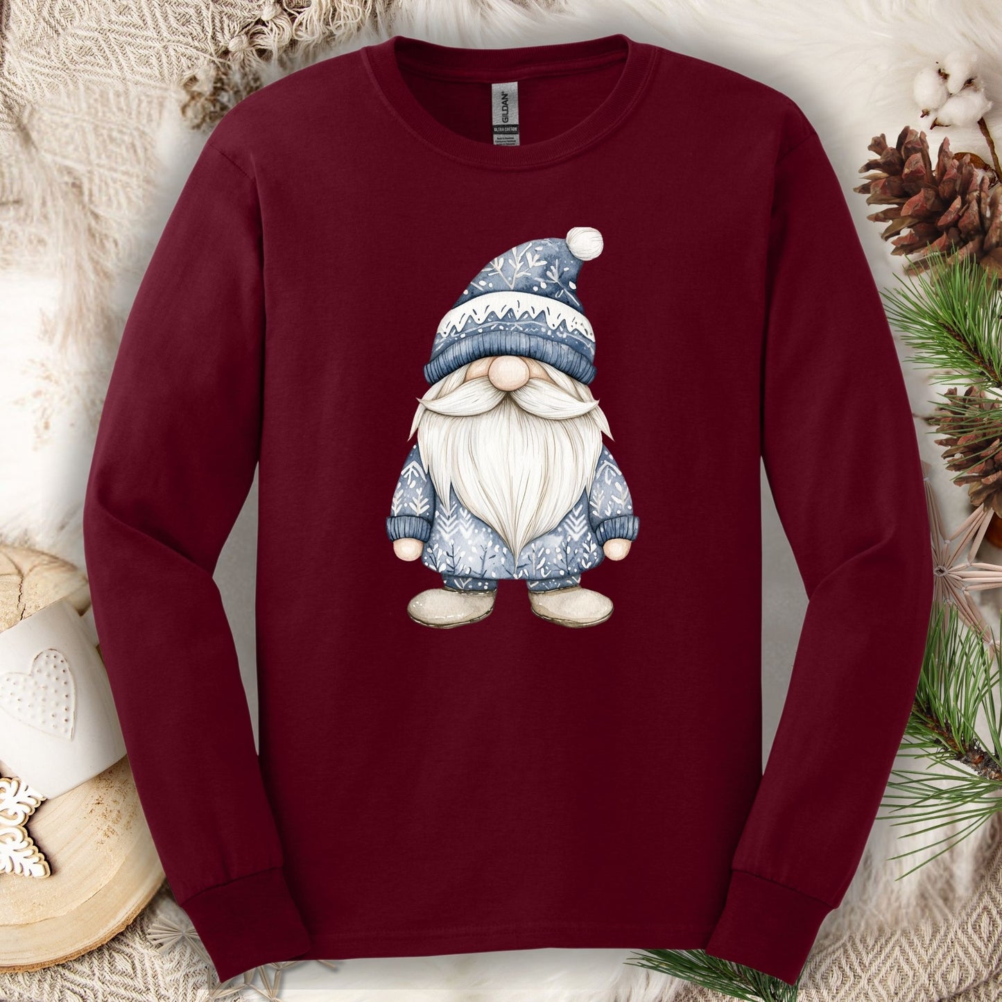 Maroon long sleeve tee with a hand-illustrated blue Nordic gnome design, made from soft USA-grown cotton.