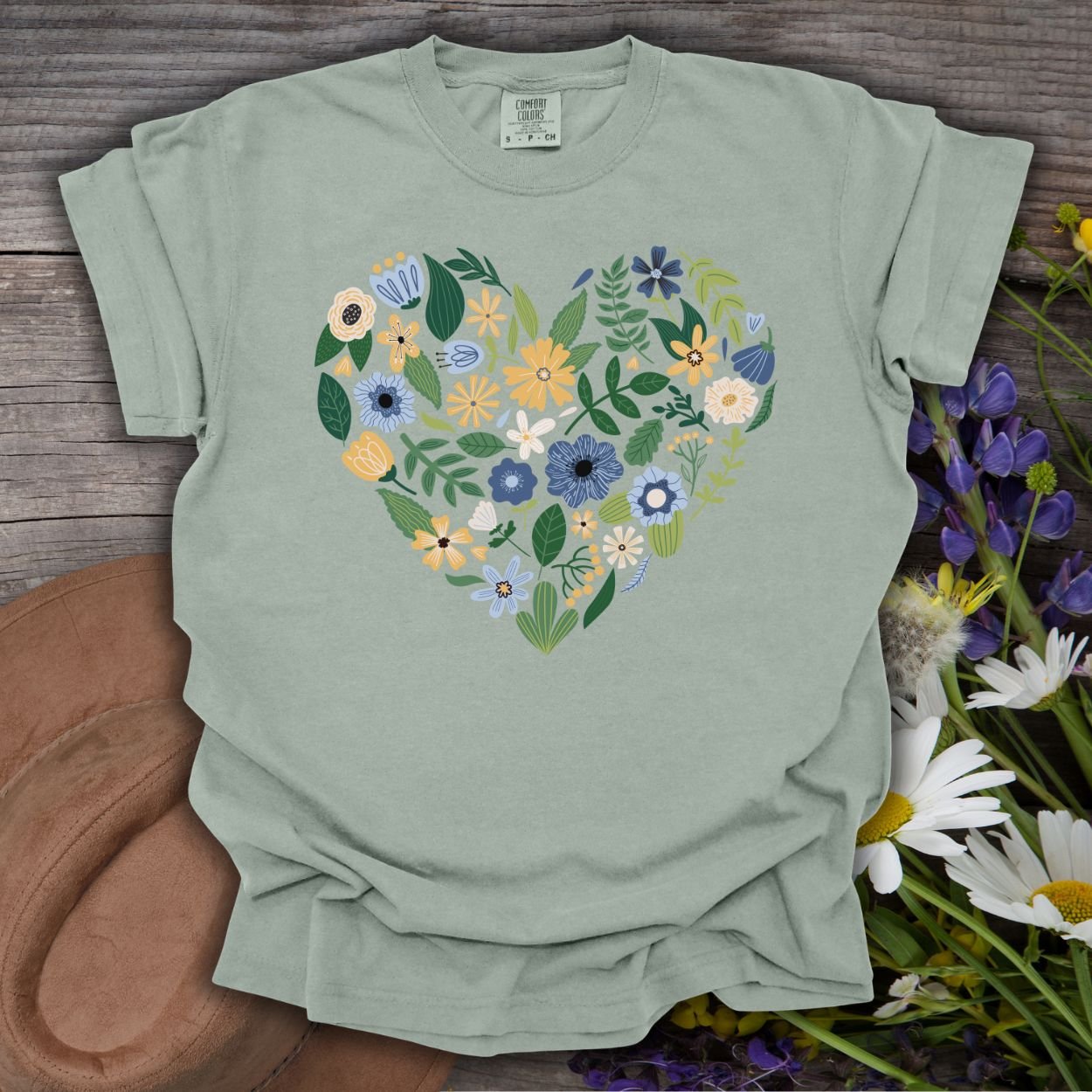 Bay-colored, relaxed-fit cotton t-shirt with a heart-shaped bouquet of blue, yellow, and navy floral designs.