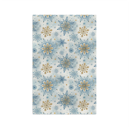 Blue and gold snowflake pattern microfiber tea towel with watercolor background, 16x25 inches.