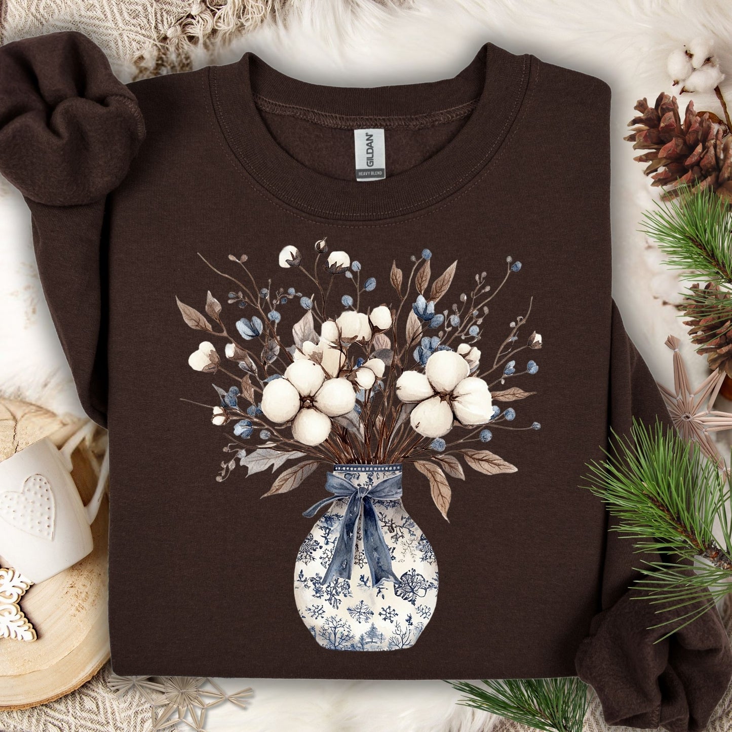 Dark chocolate sweatshirt with a blue and white winter floral bouquet in a chinoiserie vase.