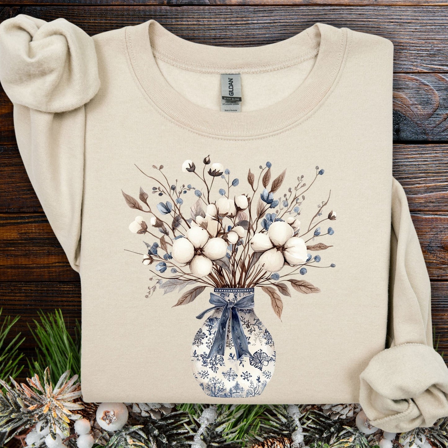 Sand sweatshirt with blue and white winter floral bouquet in a chinoiserie vase.