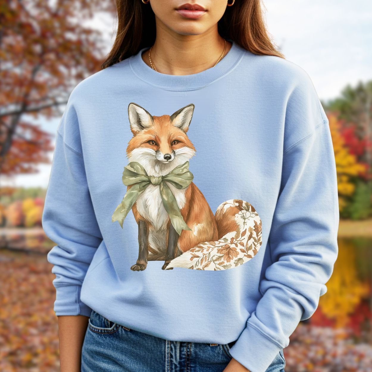 Light blue Gildan sweatshirt with a boho fox, green bow, and autumn floral tail.