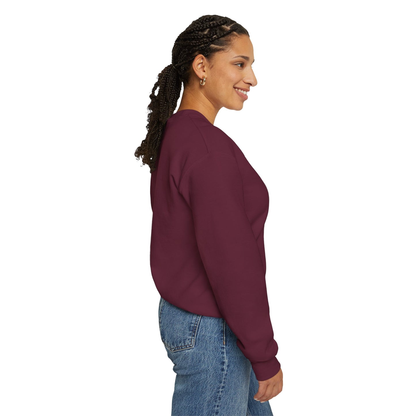 Woman in a plain maroon Gildan sweatshirt and blue jeans, smiling in profile.