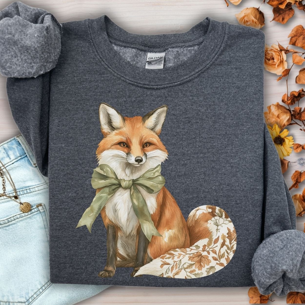 Dark Heather Gildan sweatshirt with a boho autumn floral fox design and green bow.