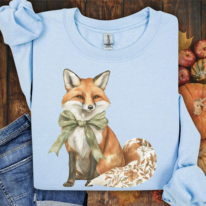 Light blue Gildan sweatshirt with a boho fox design, green bow, and autumn floral tail.