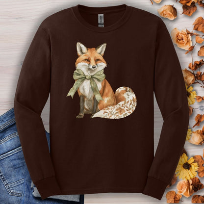 Dark Chocolate Gildan long sleeve tee with a watercolor fox, green bow, and autumn botanicals on its tail.